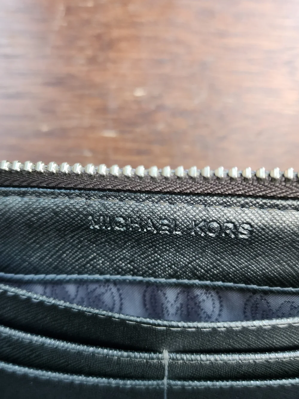Michael Kors Metallic Pewter Monogram Embossed Zip Around Wallet